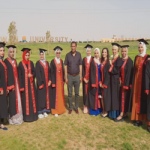 Graduation students of the Faculty of Science take memorial photos in front of the University Campus at Sahari